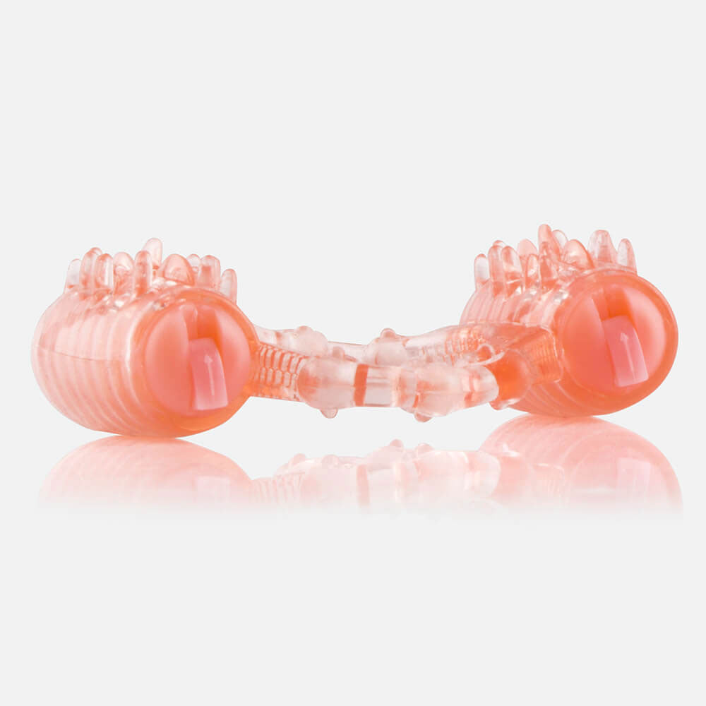 side view of a pink vibrating cock ring