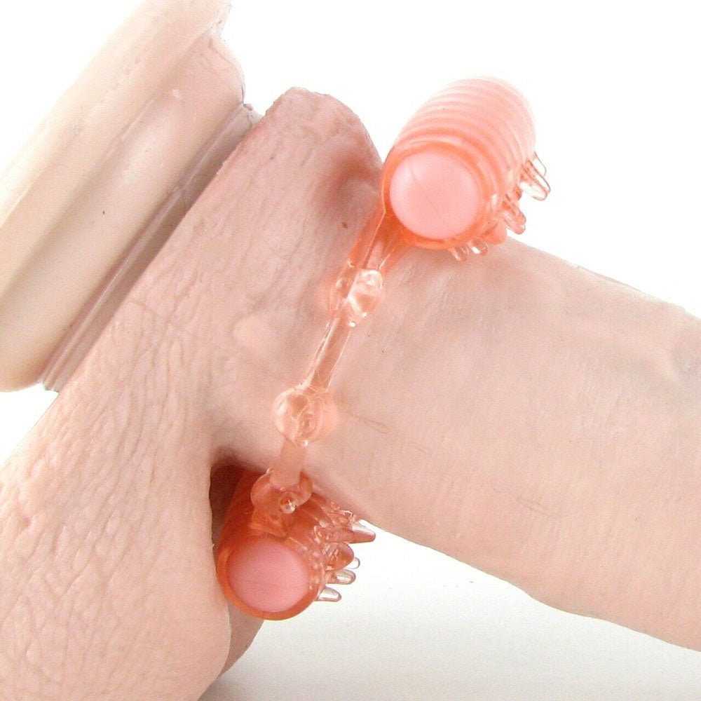 shows how to a dual motor cock ring looks on a penis