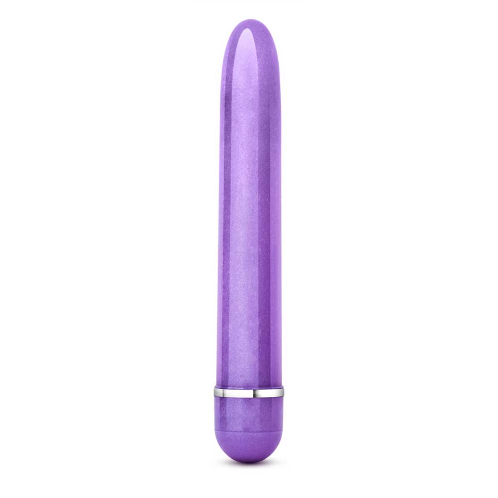 A purple Slimline Vibe by Blush Novelties out of the package on a white background.
