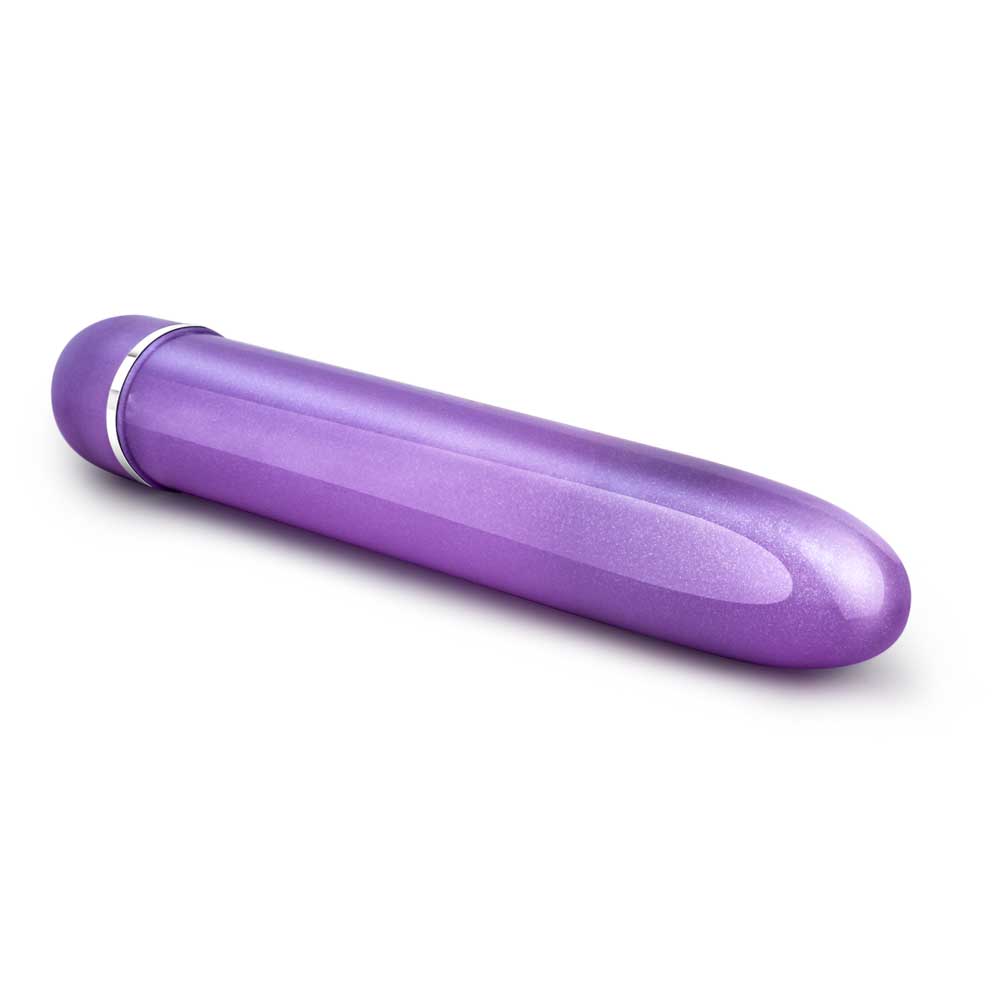A purple Slimline Vibe by Blush Novelties out of the package on a white background.