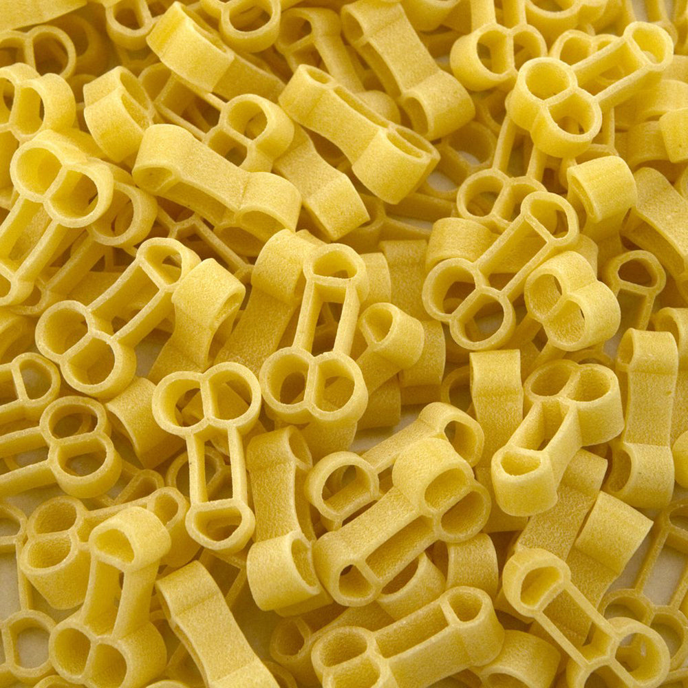 The detail of what Penis Pasta looks like out of it's box. On a White background.