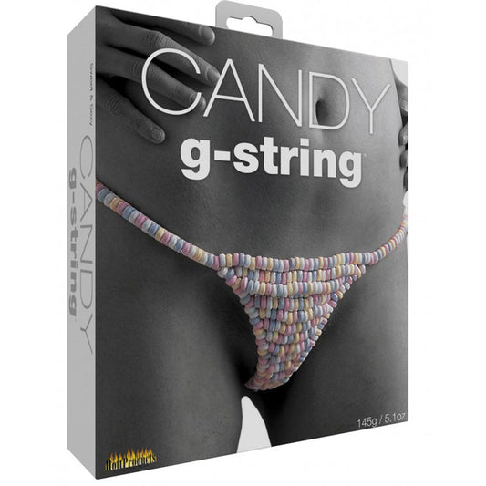 This image displays the packaging for the "Candy G-String," an edible g-string thong that is designed to be worn during intimate moments. The g-string is crafted from small, multicolored candy pieces, arranged in a pattern that resembles a traditional bikini design.