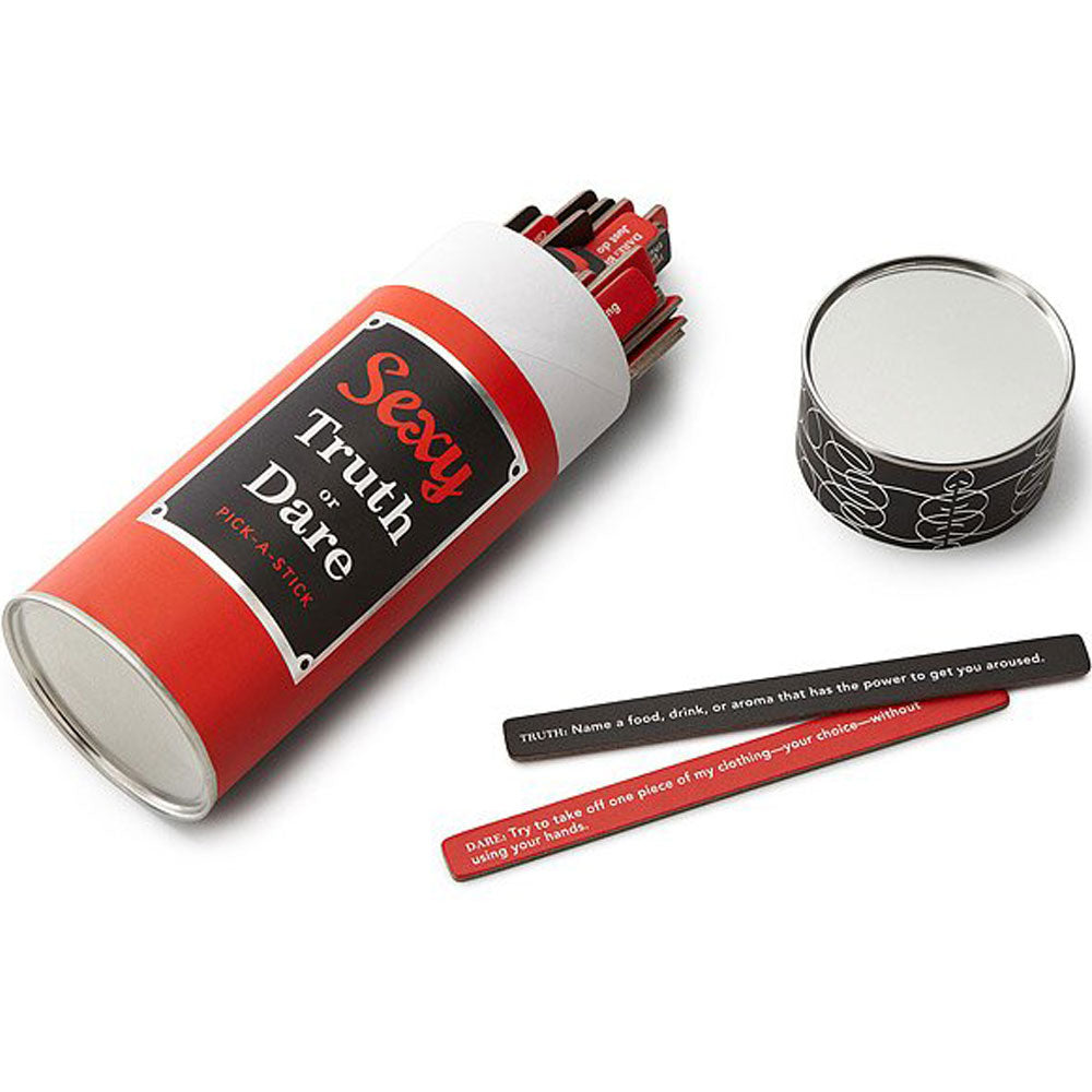 The image shows a collection of red and black sticks with written prompts for a party game called 'Sexy Truth or Dare'. These are contained in a cylindrical red container with a label that reads 'Sexy Truth or Dare'.