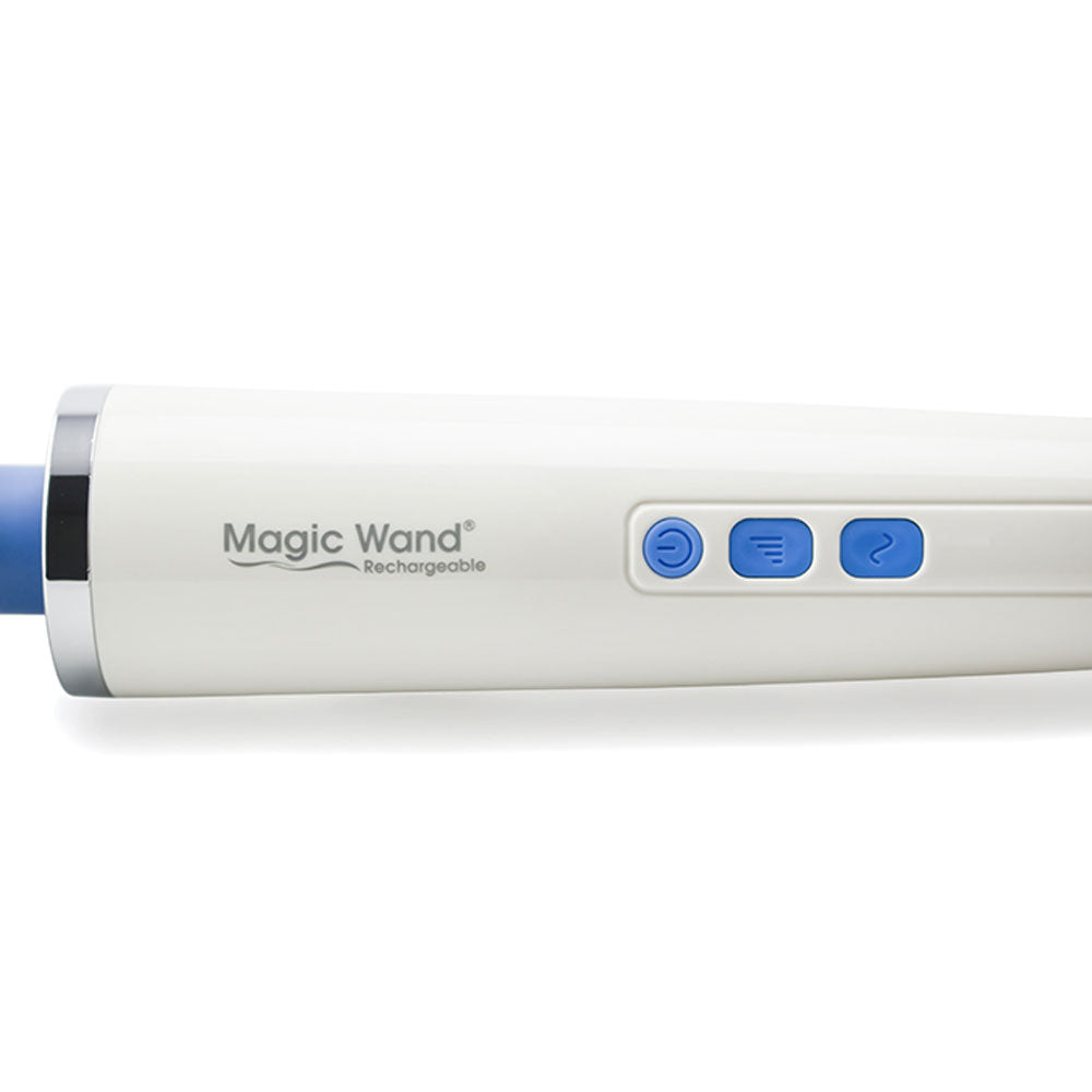 This image shows a close-up view of the operational buttons of the magic wand rechargeable. From left to right is a circular power button to turn the massager on and off, a rounded square button with four lines of increasing size on it that operates the vibration speed, and another rounded square button with a tilde symbol on it that operates pulsating functions. The massager is on a white background. 