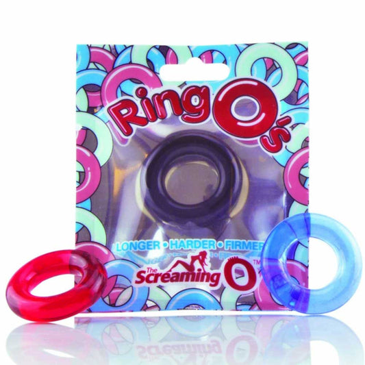The image shows a package of Screaming O Ring O's in a colorful design. The photo shows the texture of a red and a blue cock ring. The packaging highlights the product's features, including its ability to facilitate longer, harder, and firmer erections.