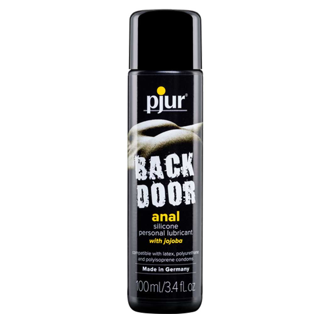 A black 100ml bottle of Pjur Back Door anal silicone lube. The package describes the product is made with jojoba oil and is made in Germany. The product is featured against a white background.