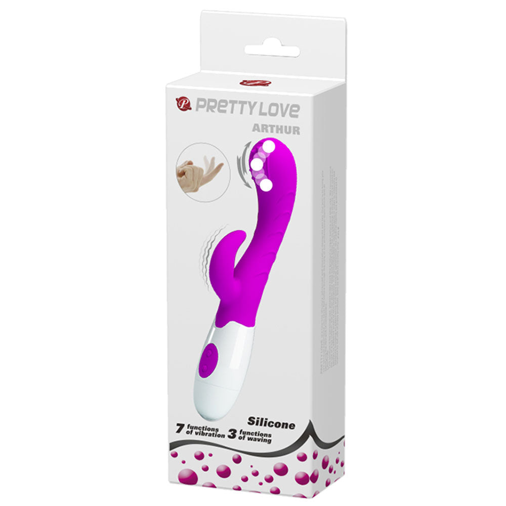 The product is a purple and white rabbit style vibrator with a rolling ball tip and an external extension for clitoral and G-Spot stimulation. It is shown in its white and pink packaging and has the brand name 'Pretty Love' on it. The model is called "Arthur".