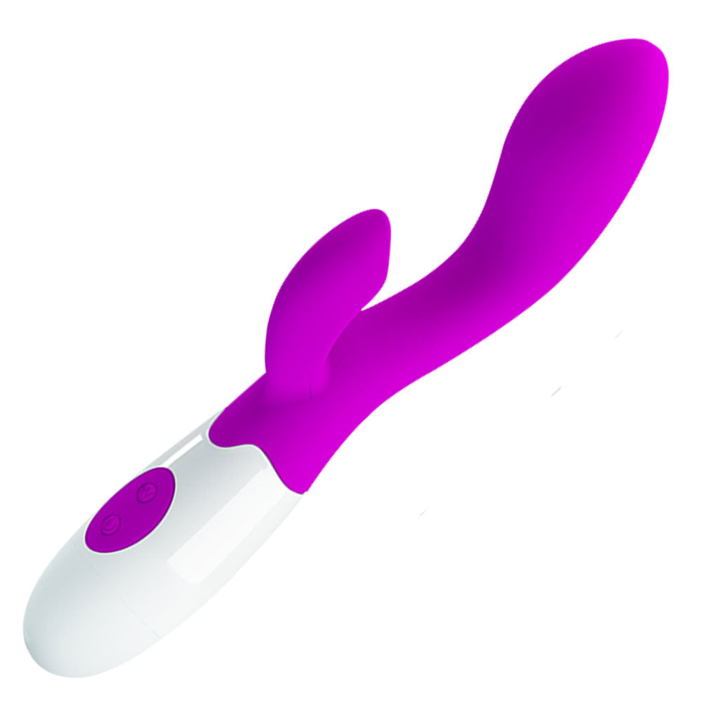 A purple and white rabbit style vibrator with a rolling ball tip and an external extension for clitoral and G-Spot stimulation against a white background.